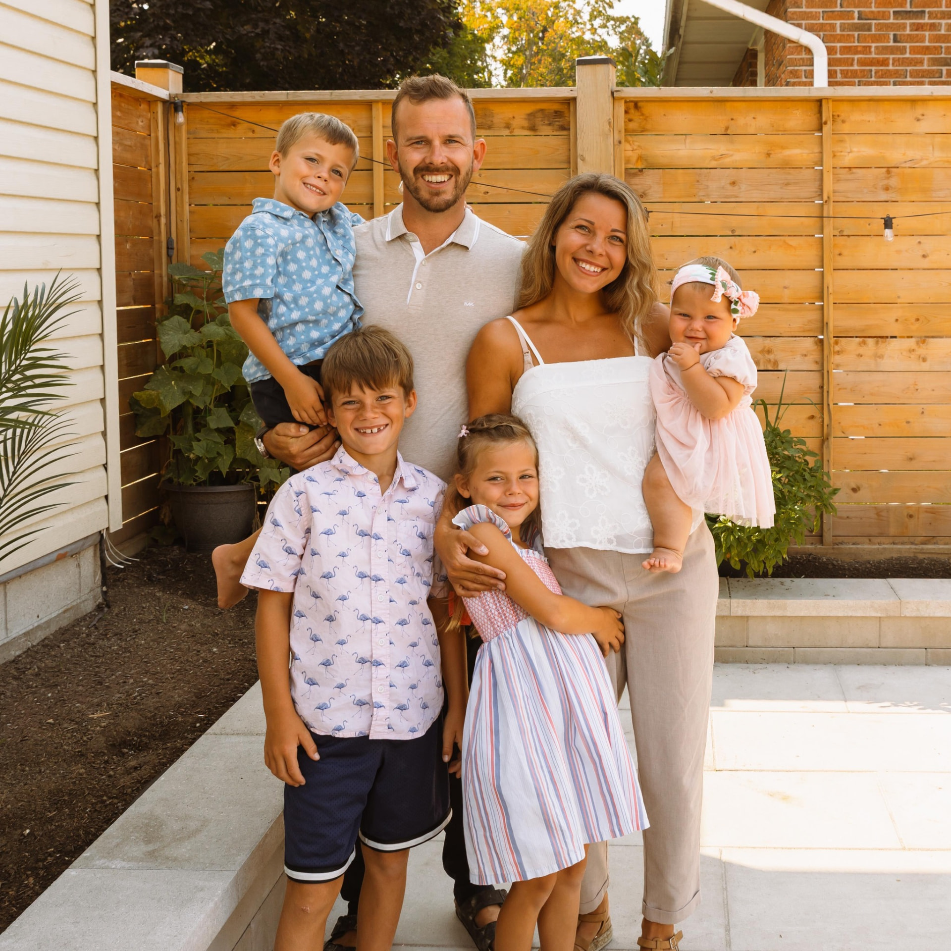 The Party Plans family — two parents and their four kids